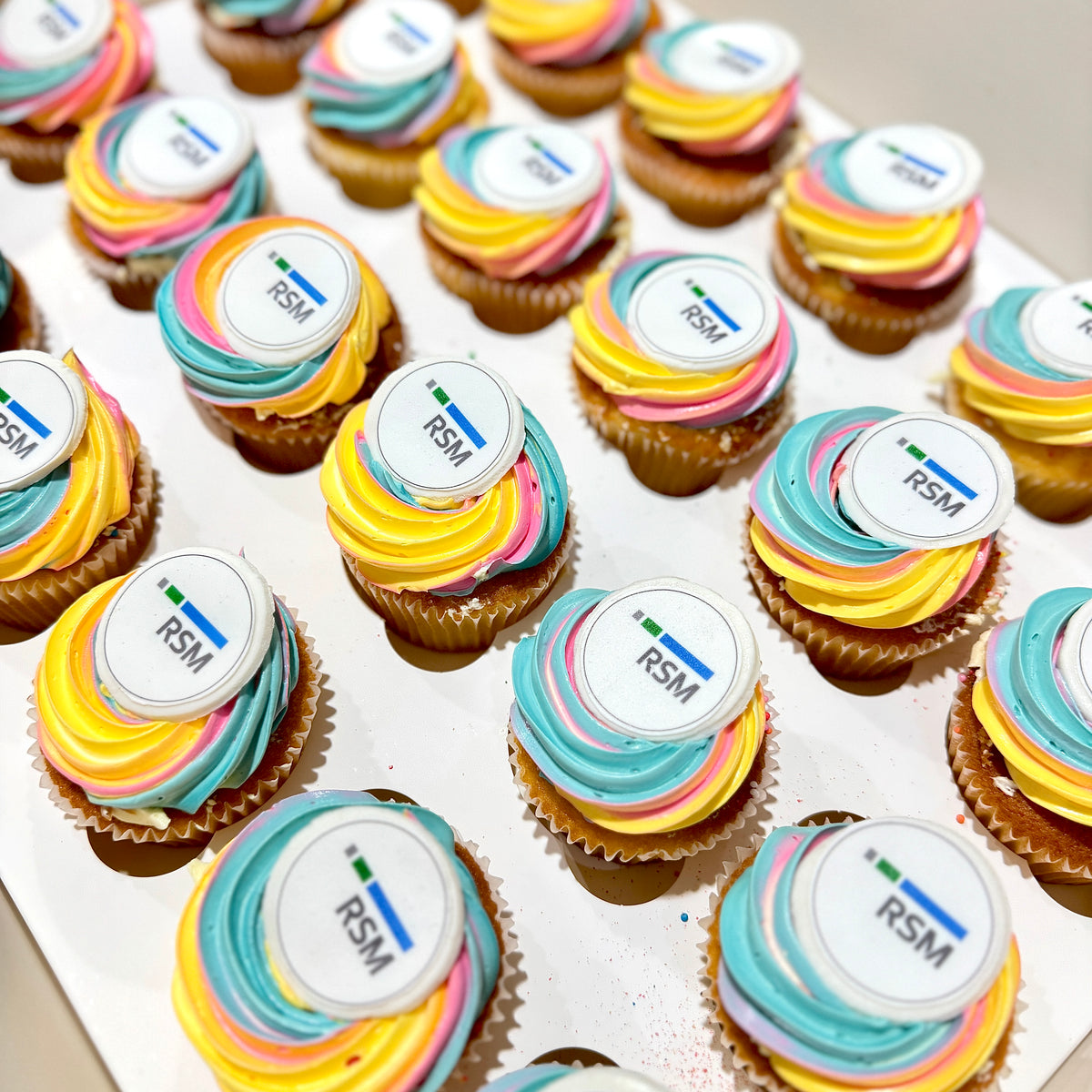 24 gluten-free corporate cupcakes with personalised edible company logo toppers in Sydney