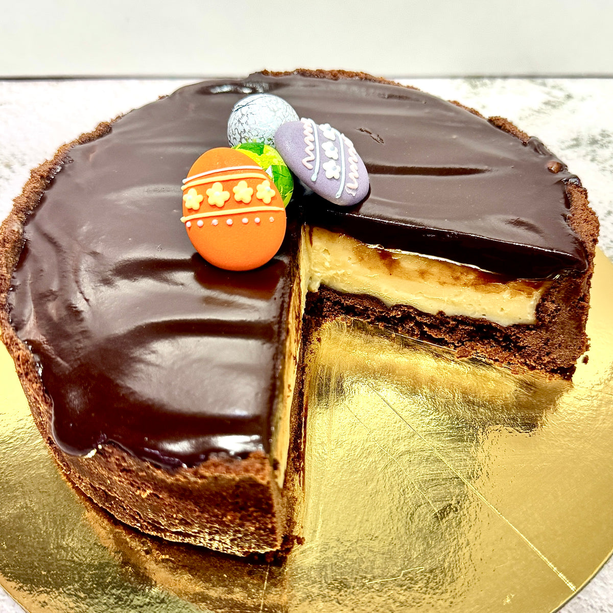 slice of chocolate custard tart with smooth vanilla filling